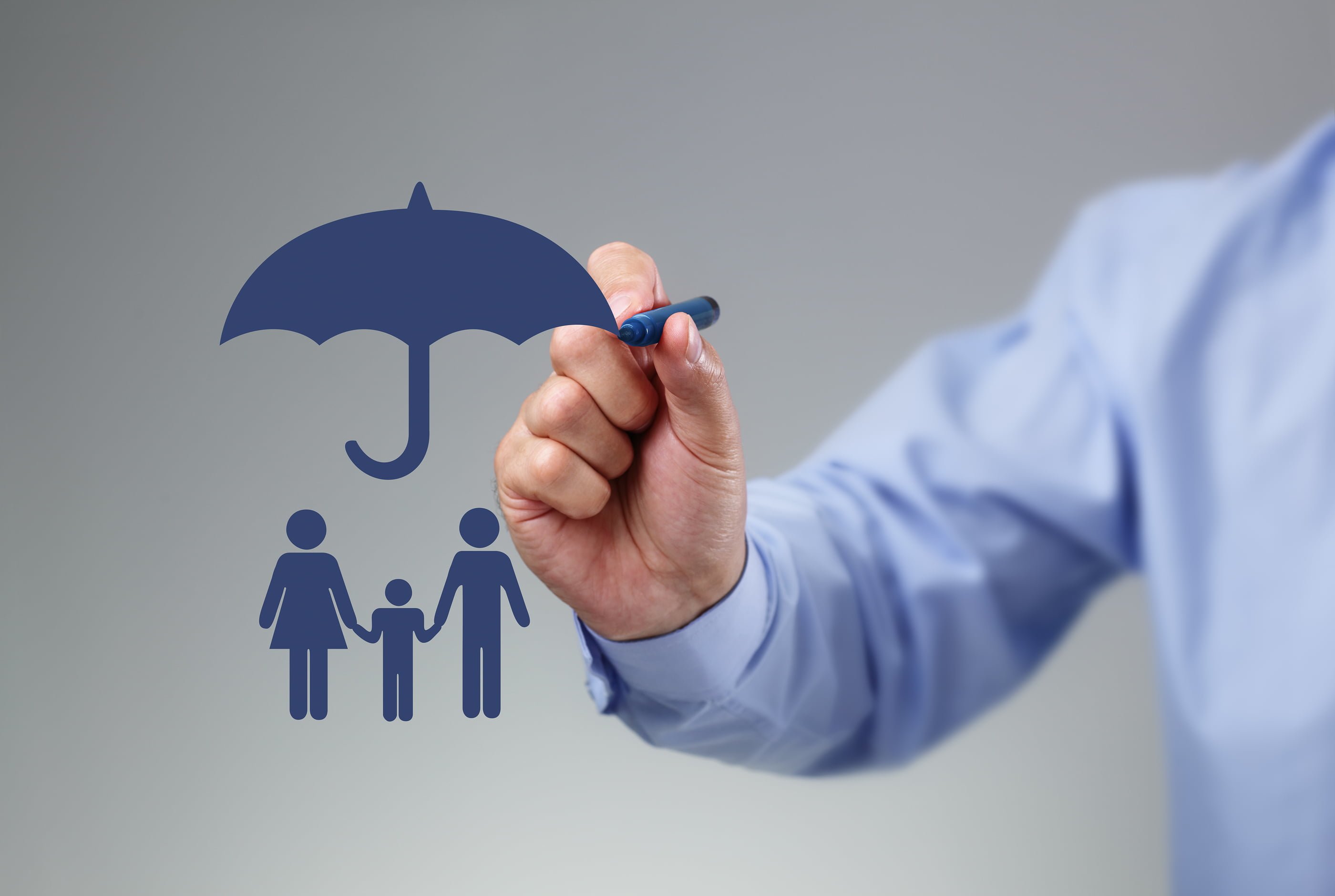 Businessman hand drawing an umbrella above a family concept for Businessman hand drawing an umbrella above a family concept for protection, security, finance and insurance